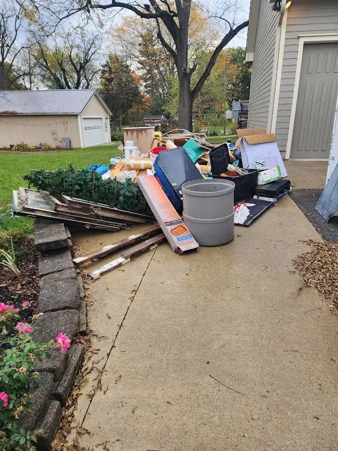 Dumpster being loaded with debris for Commercial Dumpster Rental in Carthage